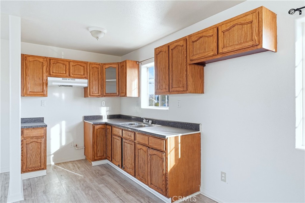 10929 Compton Avenue Los Angeles, CA 90059 - Photo 19 of 29 a kitchen with stainless steel appliances granite countertop a stove a sink and a microwave