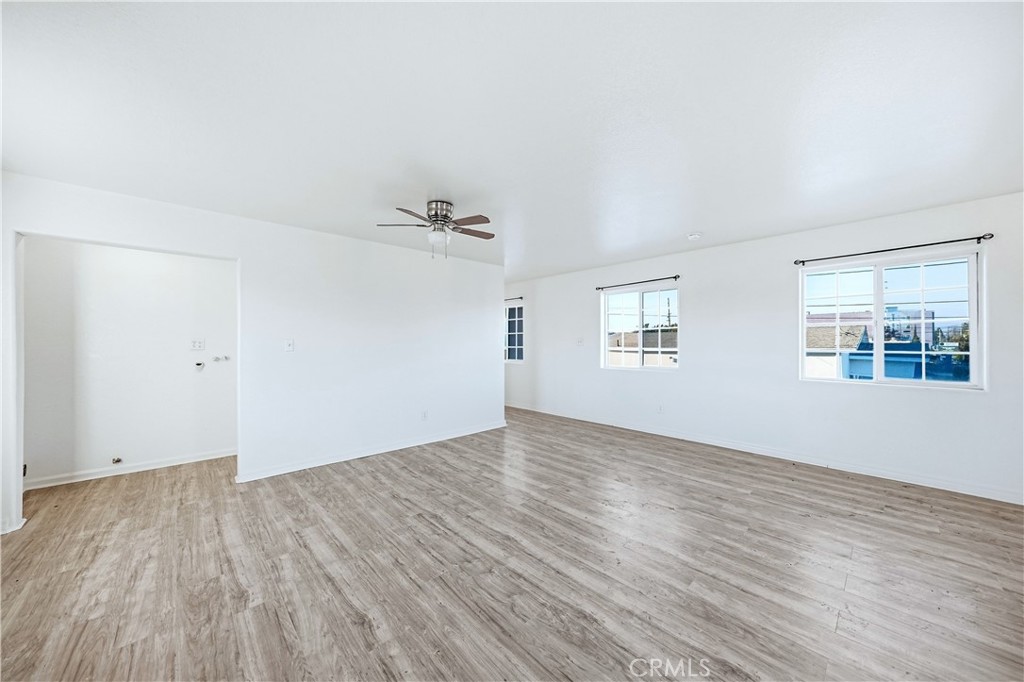 10929 Compton Avenue Los Angeles, CA 90059 - Photo 22 of 29 wooden floor in an empty room with a window