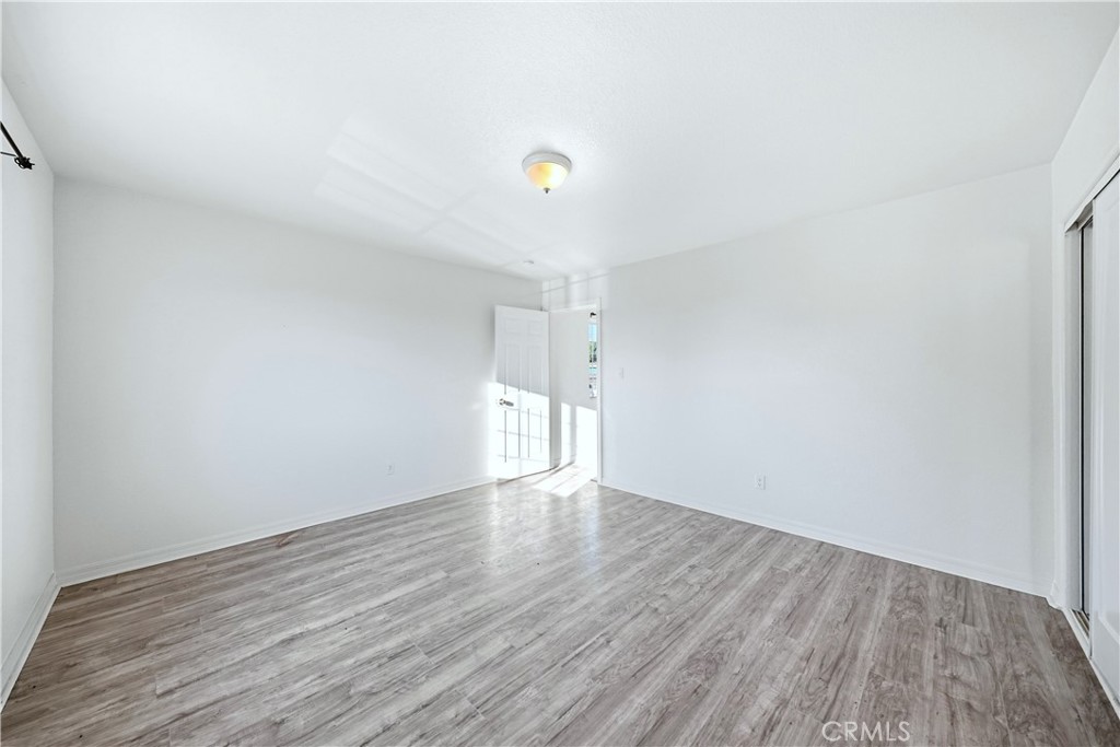 10929 Compton Avenue Los Angeles, CA 90059 - Photo 25 of 29 a view of an empty room and wooden floor