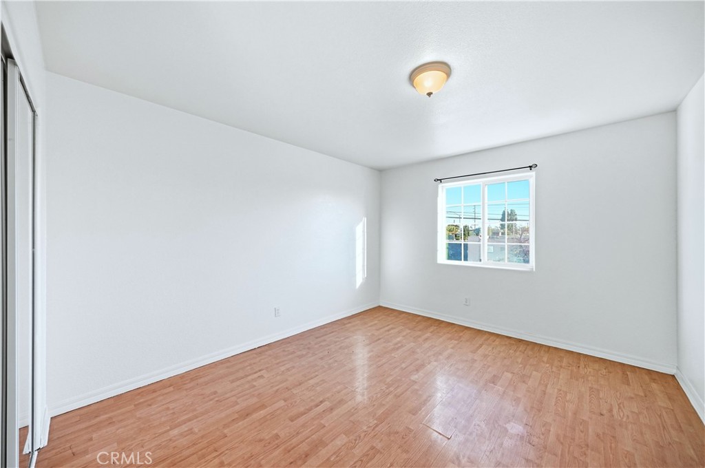 10929 Compton Avenue Los Angeles, CA 90059 - Photo 27 of 29 an empty room with a window