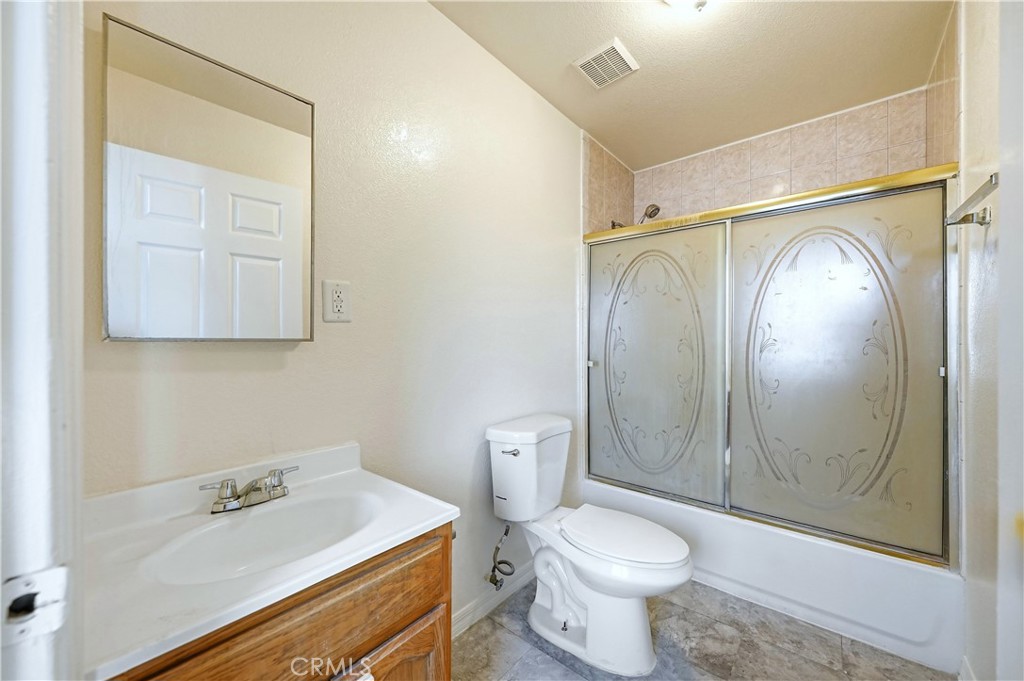10929 Compton Avenue Los Angeles, CA 90059 - Photo 29 of 29 a bathroom with a sink a toilet and shower