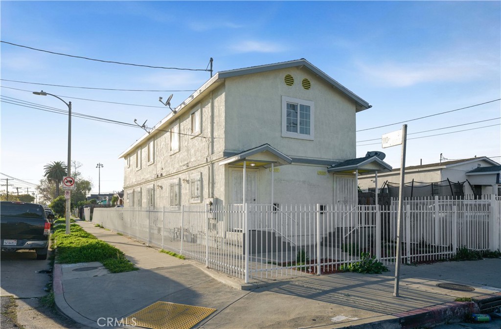 10929 Compton Avenue Los Angeles, CA 90059 - Photo 3 of 29 a front view of a house with garage