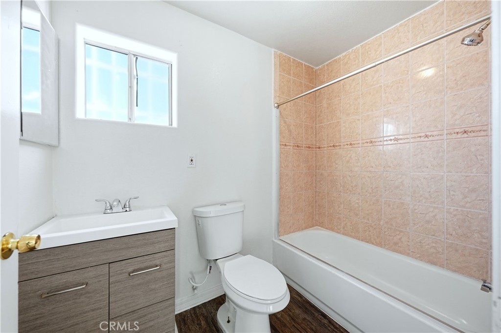 10929 Compton Avenue Los Angeles, CA 90059 - Photo 10 of 29 a bathroom with a sink a toilet and shower