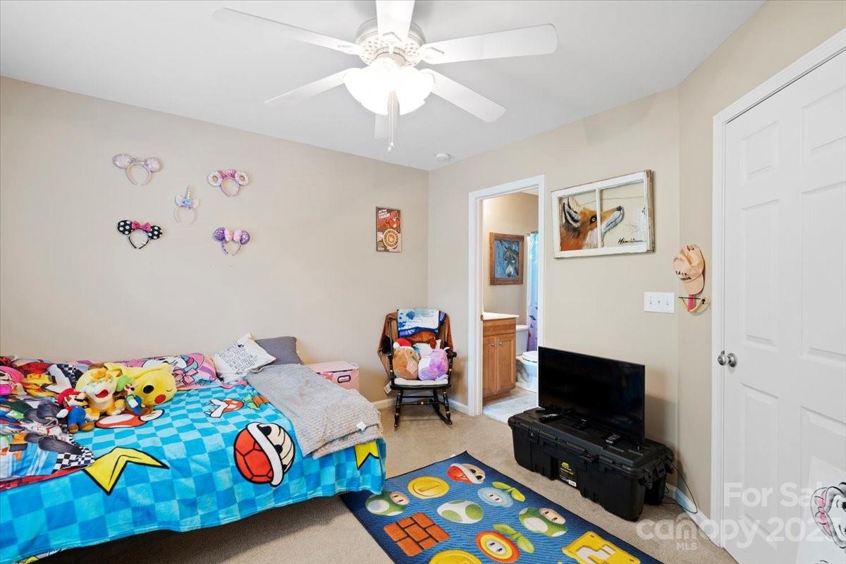 3006 Summerfield Ridge Lane Matthews, NC 28105 - Photo 14 of 17 a room with toys and a couch