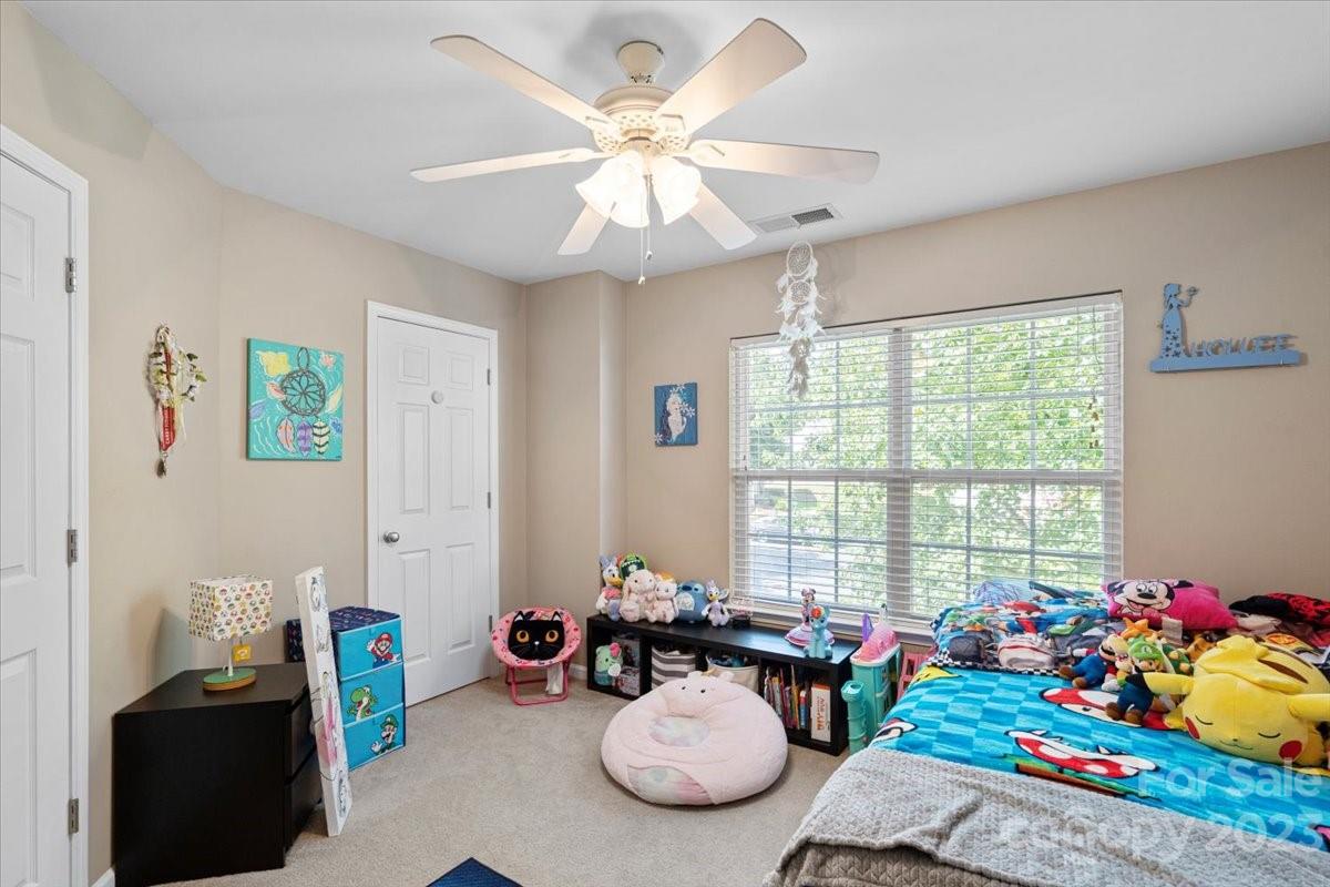 3006 Summerfield Ridge Lane Matthews, NC 28105 - Photo 15 of 17 a room with furniture toys and a chandelier