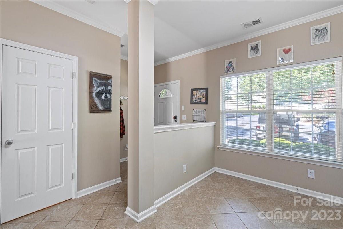 3006 Summerfield Ridge Lane Matthews, NC 28105 - Photo 2 of 17 a view of hallway with window and furniture