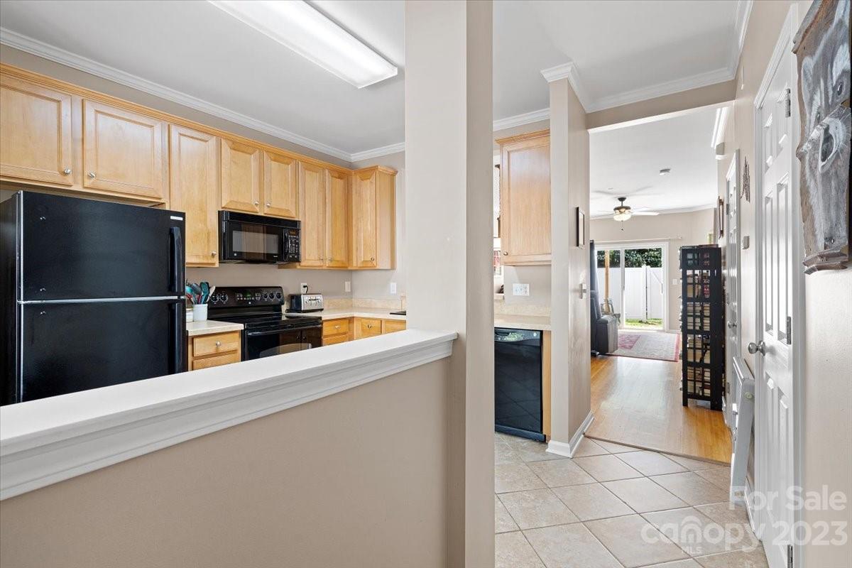 3006 Summerfield Ridge Lane Matthews, NC 28105 - Photo 3 of 17 a kitchen with stainless steel appliances a refrigerator a stove a sink a microwave and cabinets