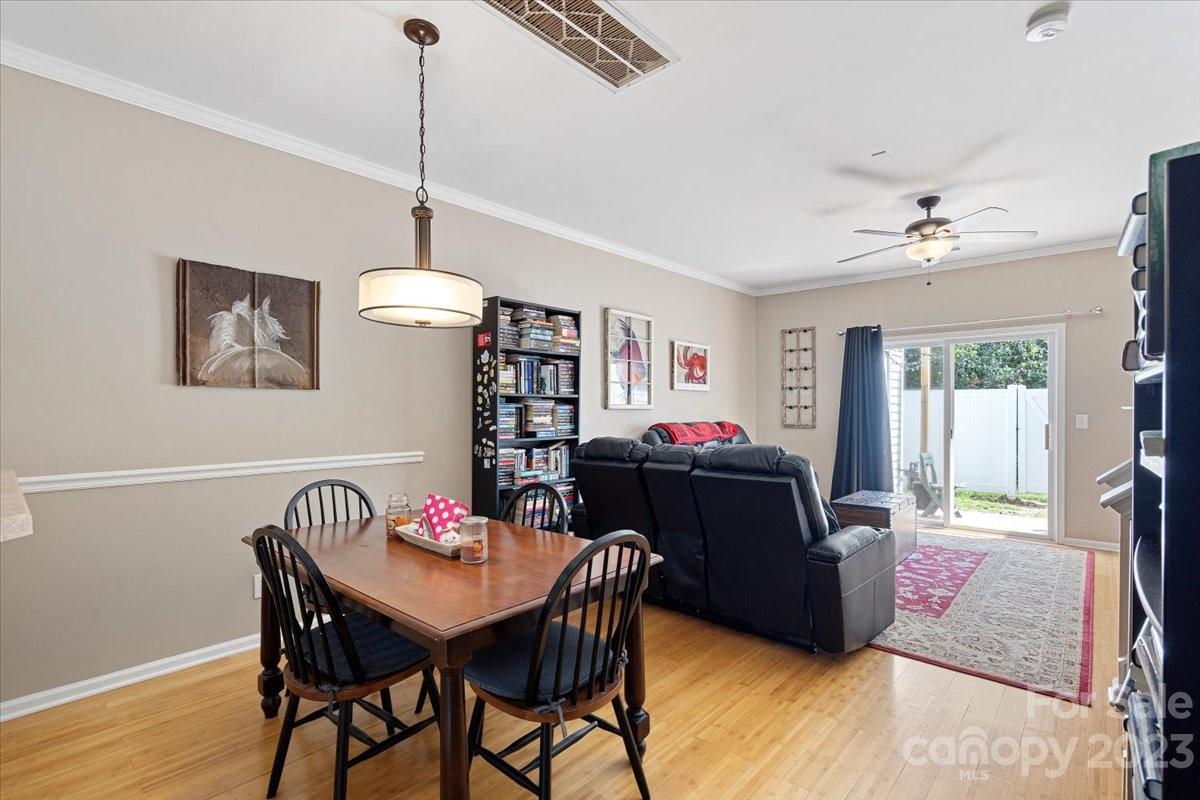 3006 Summerfield Ridge Lane Matthews, NC 28105 - Photo 6 of 17 a view of a dining room with furniture window and wooden floor