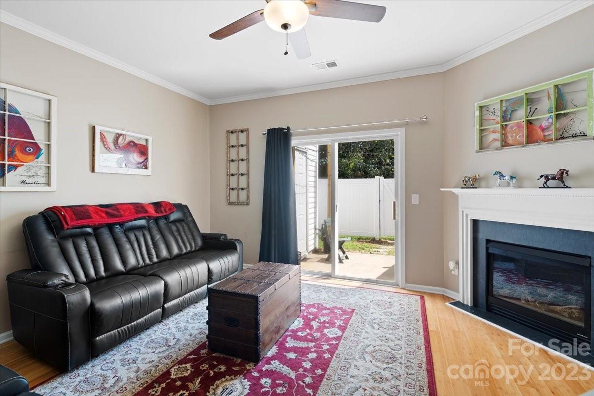 3006 Summerfield Ridge Lane Matthews, NC 28105 - Photo 7 of 17 a living room with furniture fireplace and window