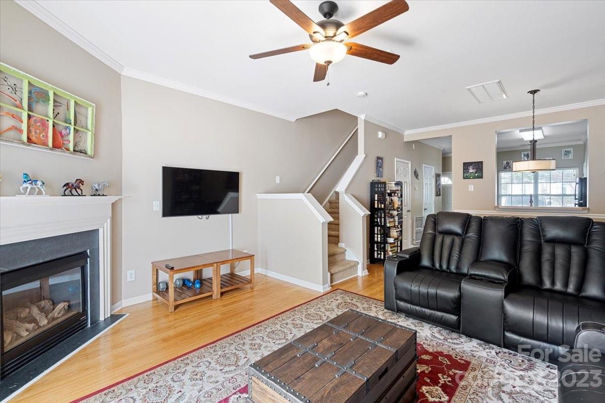 3006 Summerfield Ridge Lane Matthews, NC 28105 - Photo 8 of 17 a living room with furniture and a fireplace