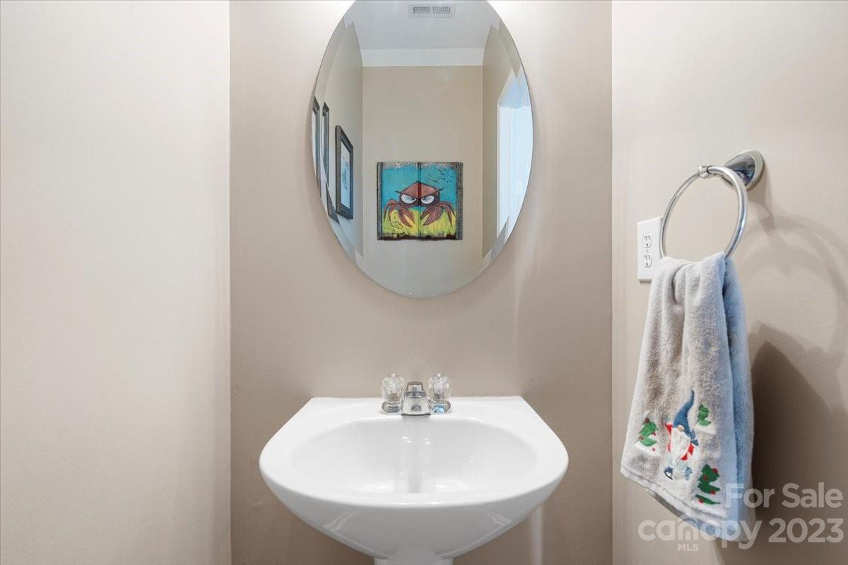 3006 Summerfield Ridge Lane Matthews, NC 28105 - Photo 9 of 17 a bathroom with a sink and mirror