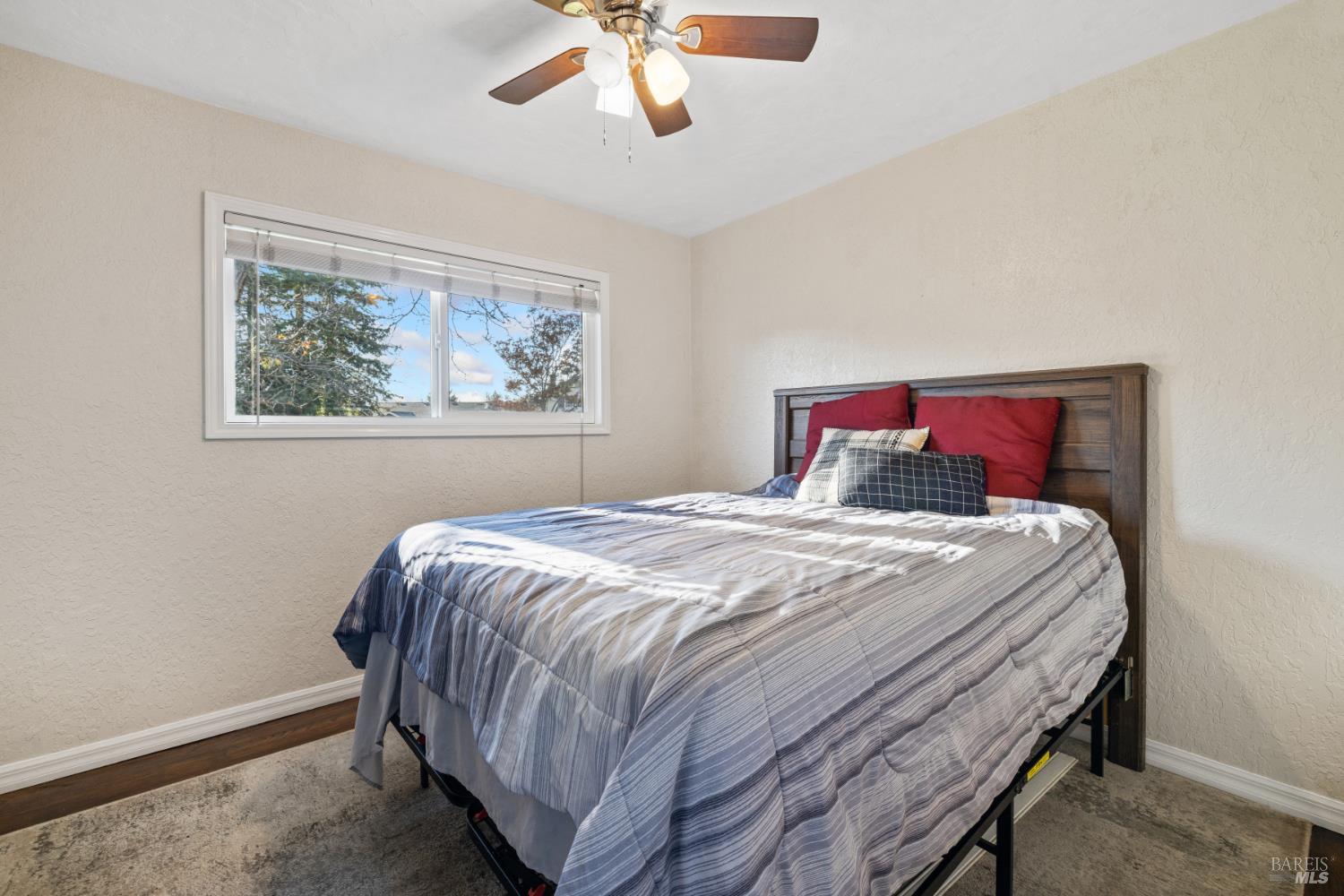 2825 Seneca Lane Santa Rosa, CA 95403 - Photo 20 of 43 Nice size first bedroom with walk in closet plus ceiling fan, dual paned window and hardwood floors.
