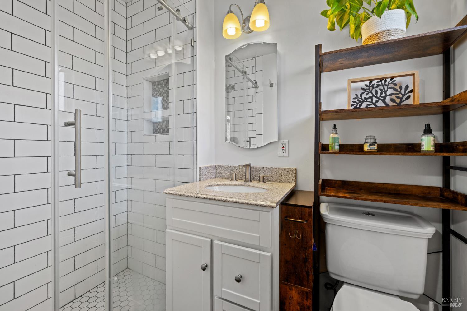 2825 Seneca Lane Santa Rosa, CA 95403 - Photo 28 of 43 This quaint primary bath has all you need with a subway tile walk-in shower, updated vanity, tile flooring, and fixtures.