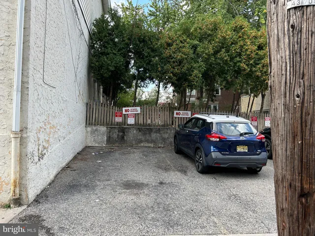a car parked in front of a house