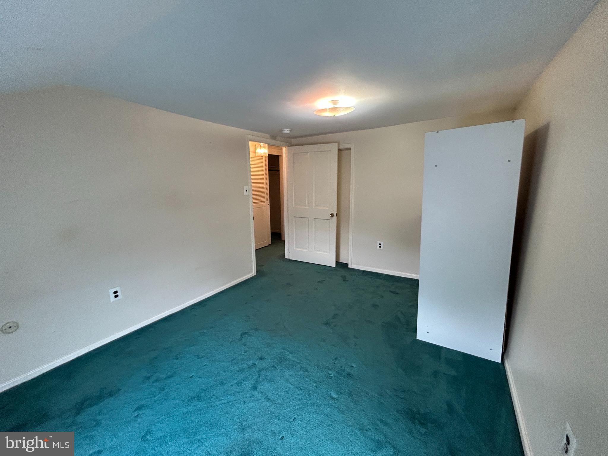 6502 Ridge Avenue, Unit 2 Philadelphia, PA 19128 - Photo 8 of 12 an empty room with an empty space and a window