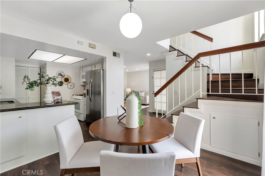 2245 Cheyenne Way, Unit 46 Fullerton, CA 92833 - Photo 11 of 30 a view of a dining room with furniture and wooden floor