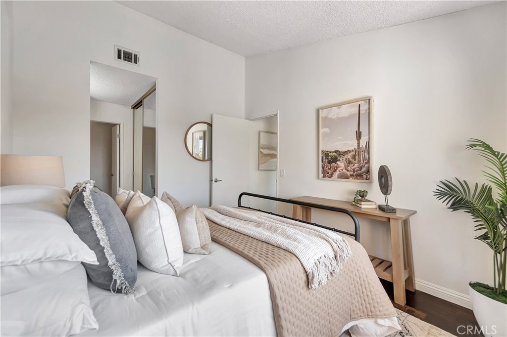 2245 Cheyenne Way, Unit 46 Fullerton, CA 92833 - Photo 15 of 30 a bedroom with a bed and a lamp