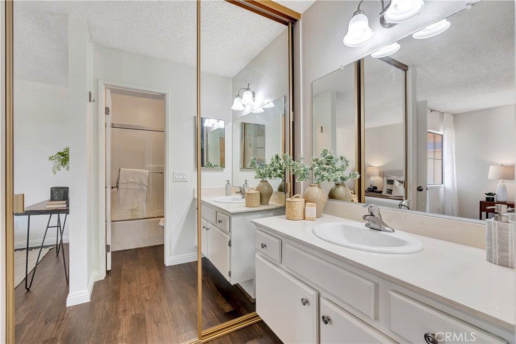 2245 Cheyenne Way, Unit 46 Fullerton, CA 92833 - Photo 18 of 30 a bathroom with a double vanity sink and a mirror