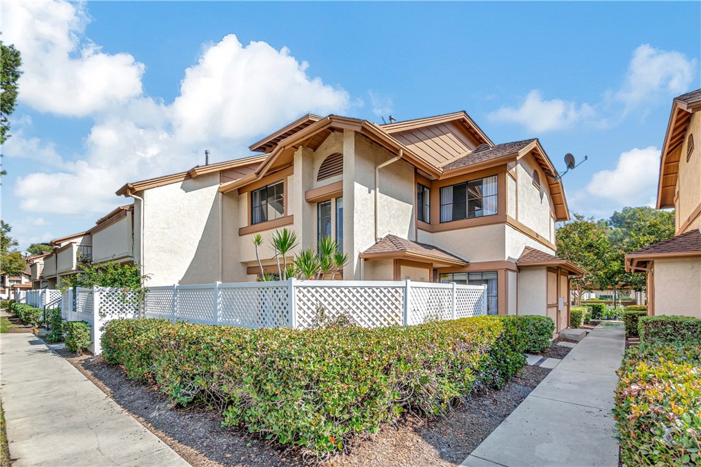 2245 Cheyenne Way, Unit 46 Fullerton, CA 92833 - Photo 25 of 30 a front view of a house with a garden