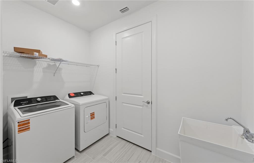15707 Northridge Road Punta Gorda, FL 33982 - Photo 16 of 21 a utility room with dryer and washer