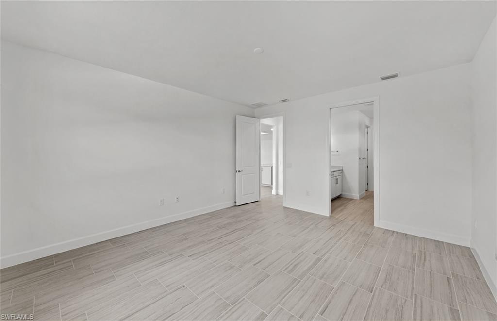 15707 Northridge Road Punta Gorda, FL 33982 - Photo 10 of 21 a view of an empty room and wooden floor