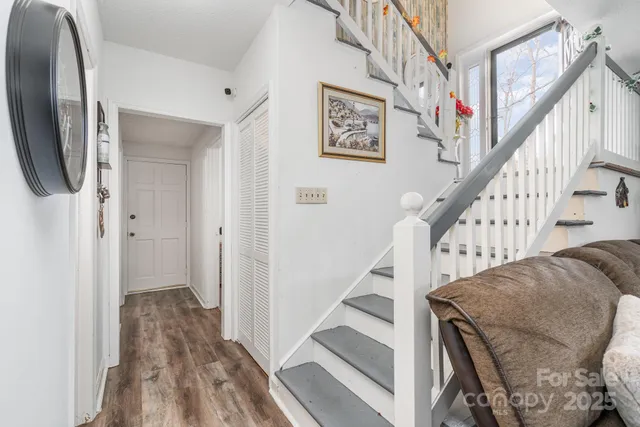 a view of entryway with wooden floor