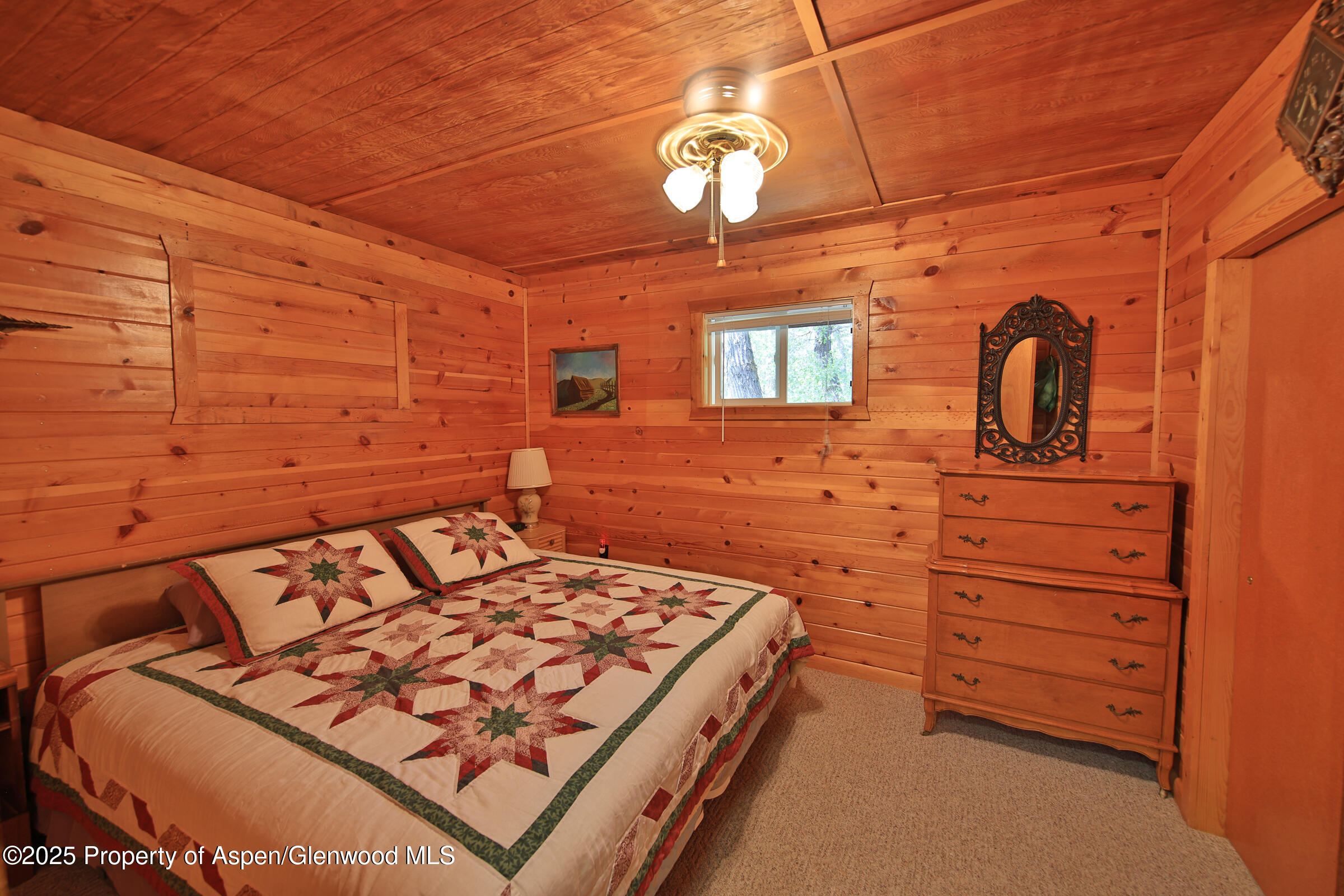 9681 54 7/10 Road Molina, CO 81646 - Photo 15 of 39 a bedroom with a bed and a dresser