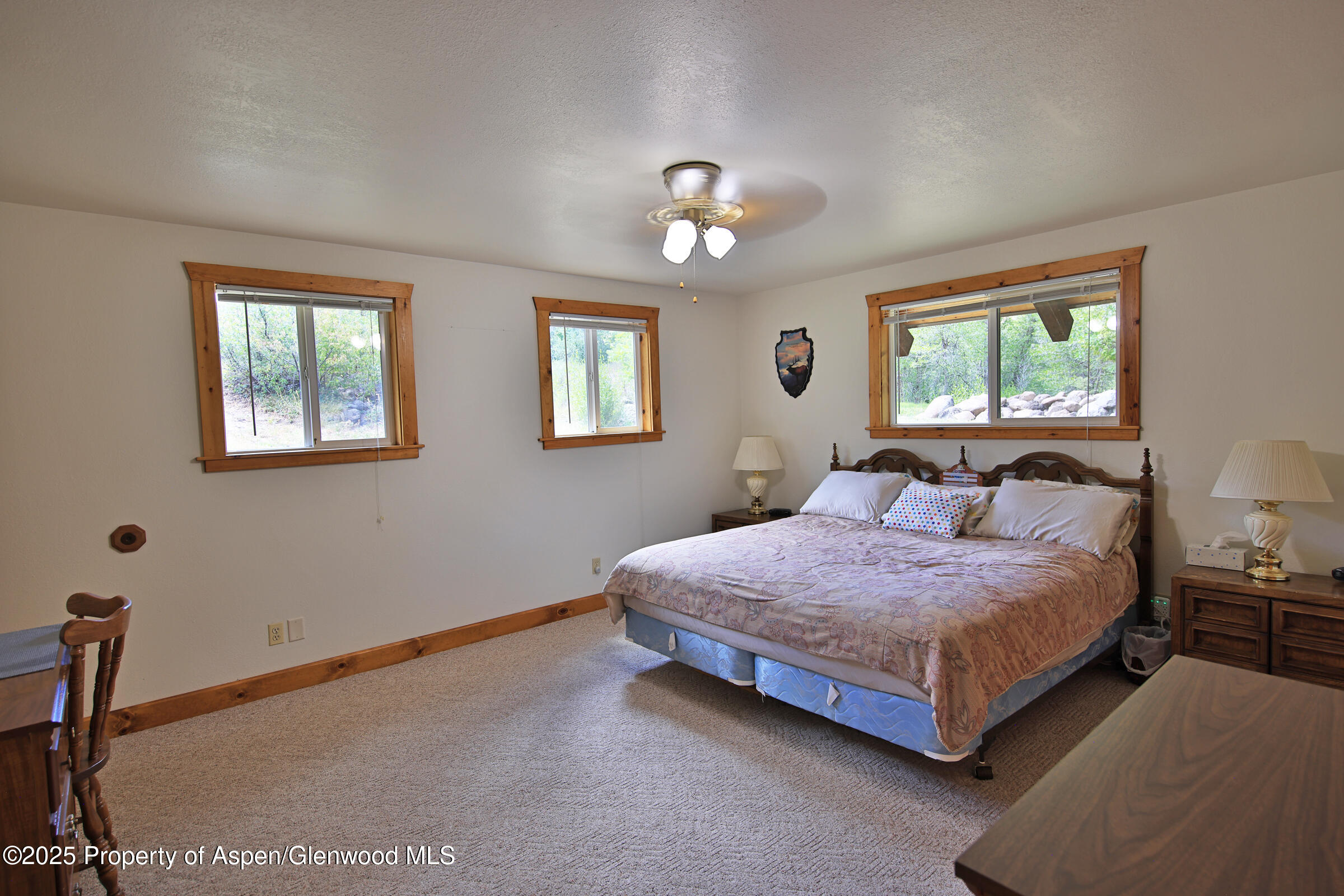 9681 54 7/10 Road Molina, CO 81646 - Photo 18 of 39 a bedroom with a bed chandelier and a window