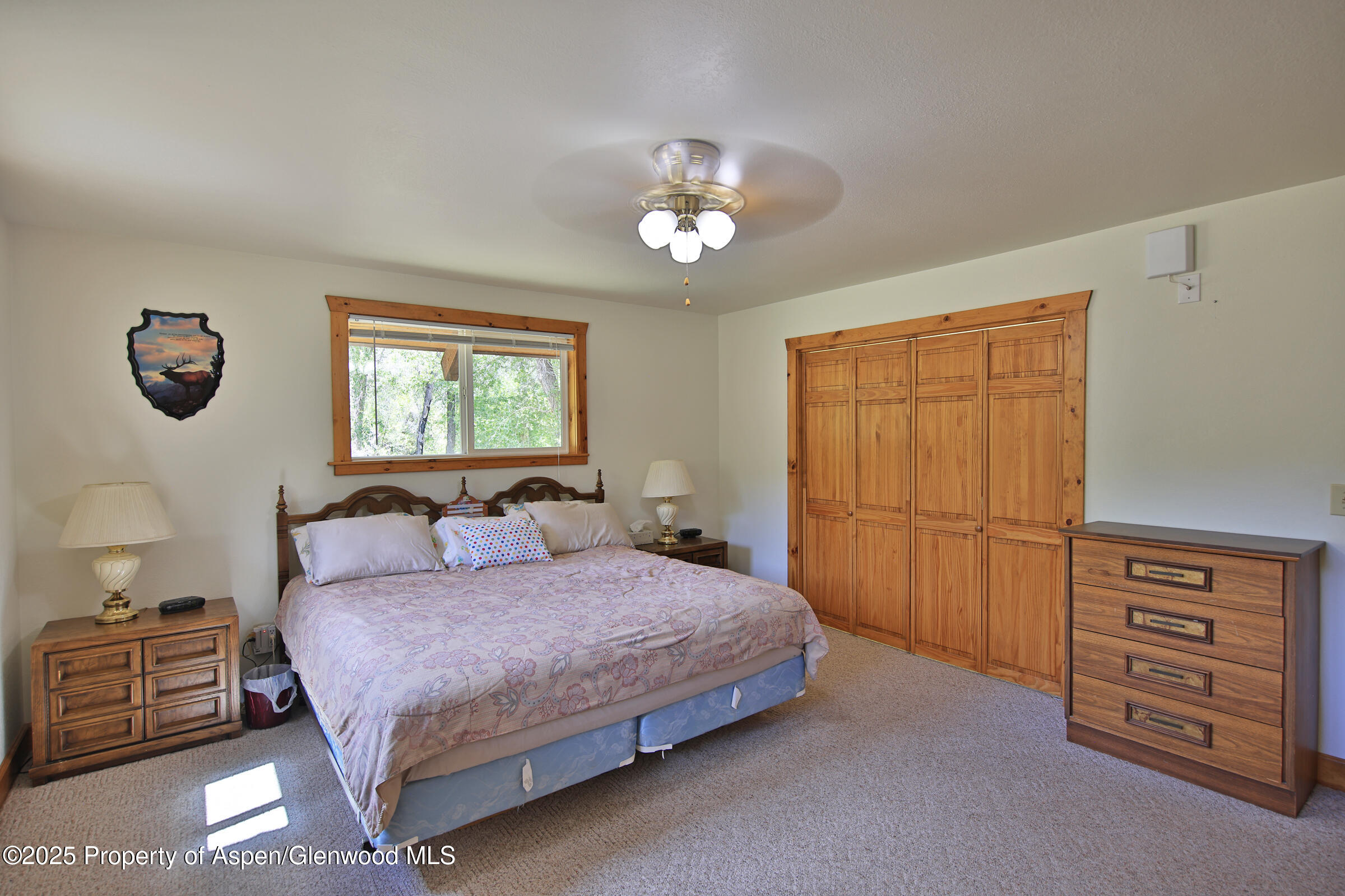 9681 54 7/10 Road Molina, CO 81646 - Photo 19 of 39 a bedroom with a bed and a dresser with the balcony