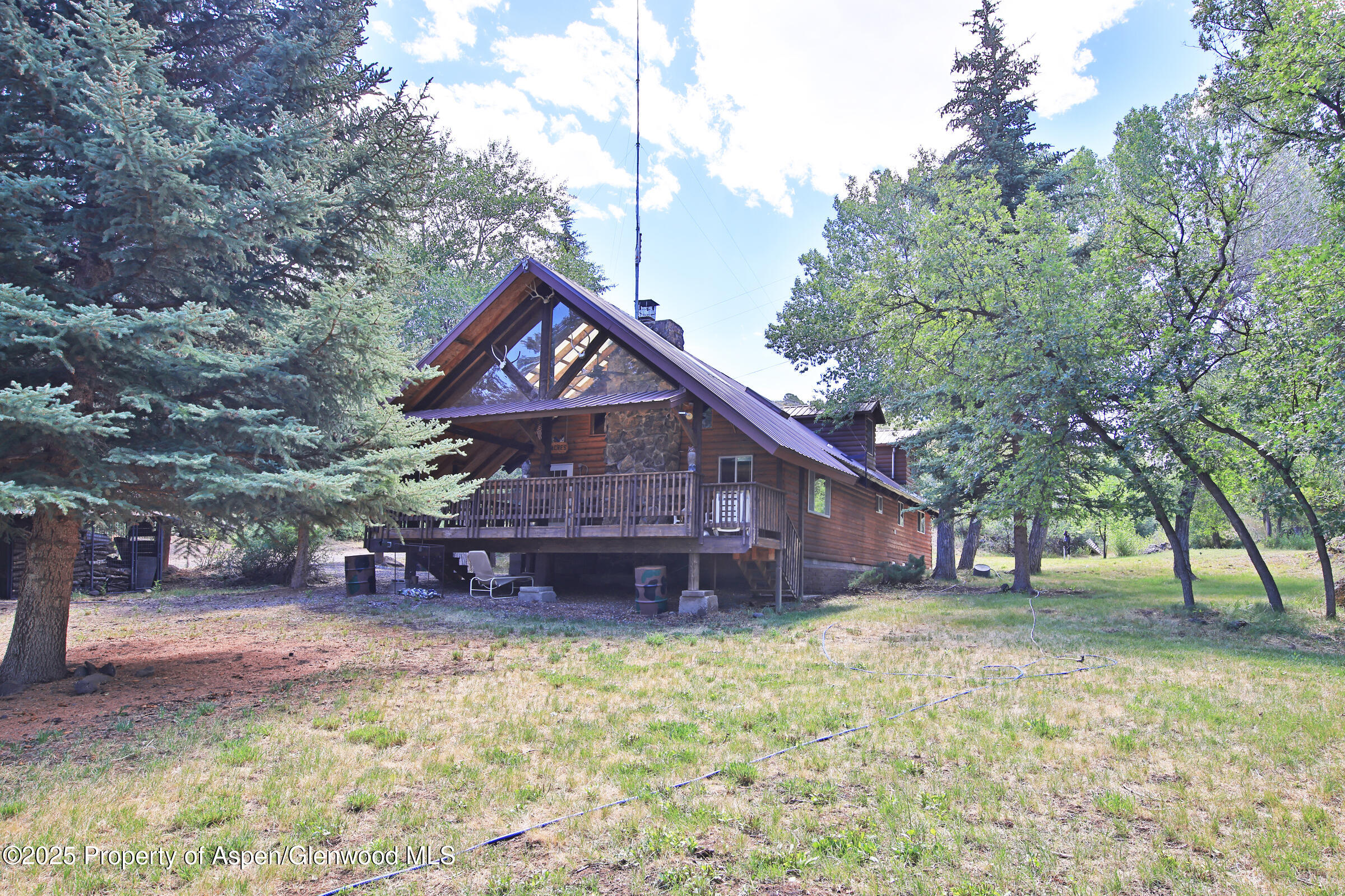 9681 54 7/10 Road Molina, CO 81646 - Photo 2 of 39 a front view of a house with a yard