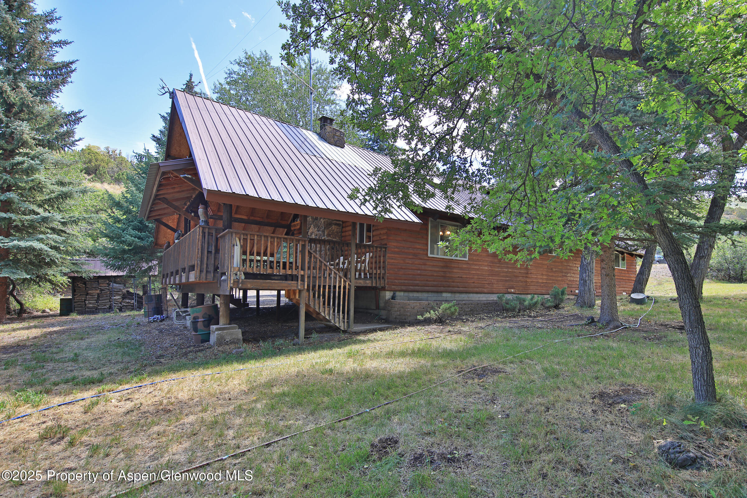 9681 54 7/10 Road Molina, CO 81646 - Photo 27 of 39 a view of a house with a yard porch and sitting area