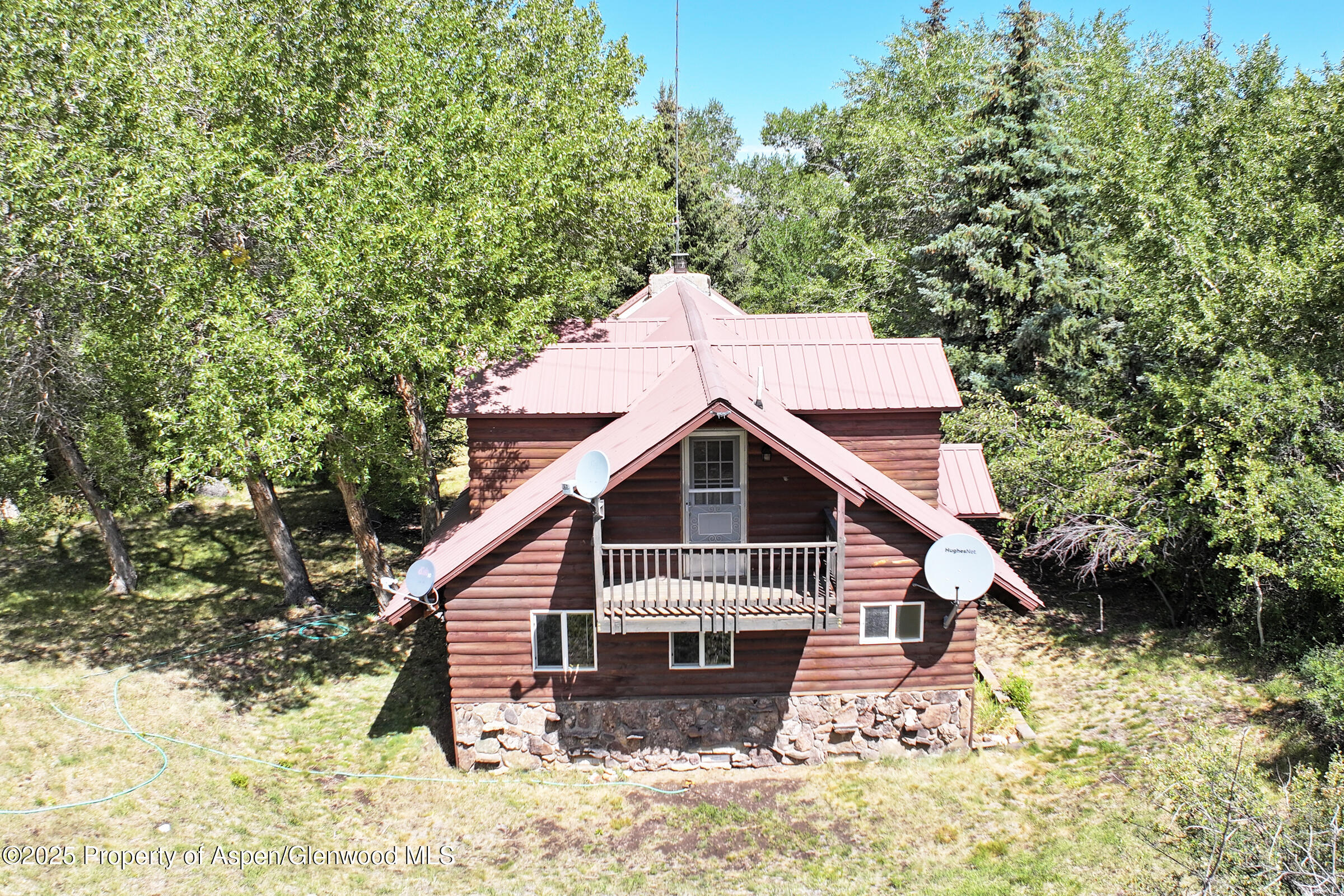 9681 54 7/10 Road Molina, CO 81646 - Photo 30 of 39 a view of a house with a yard