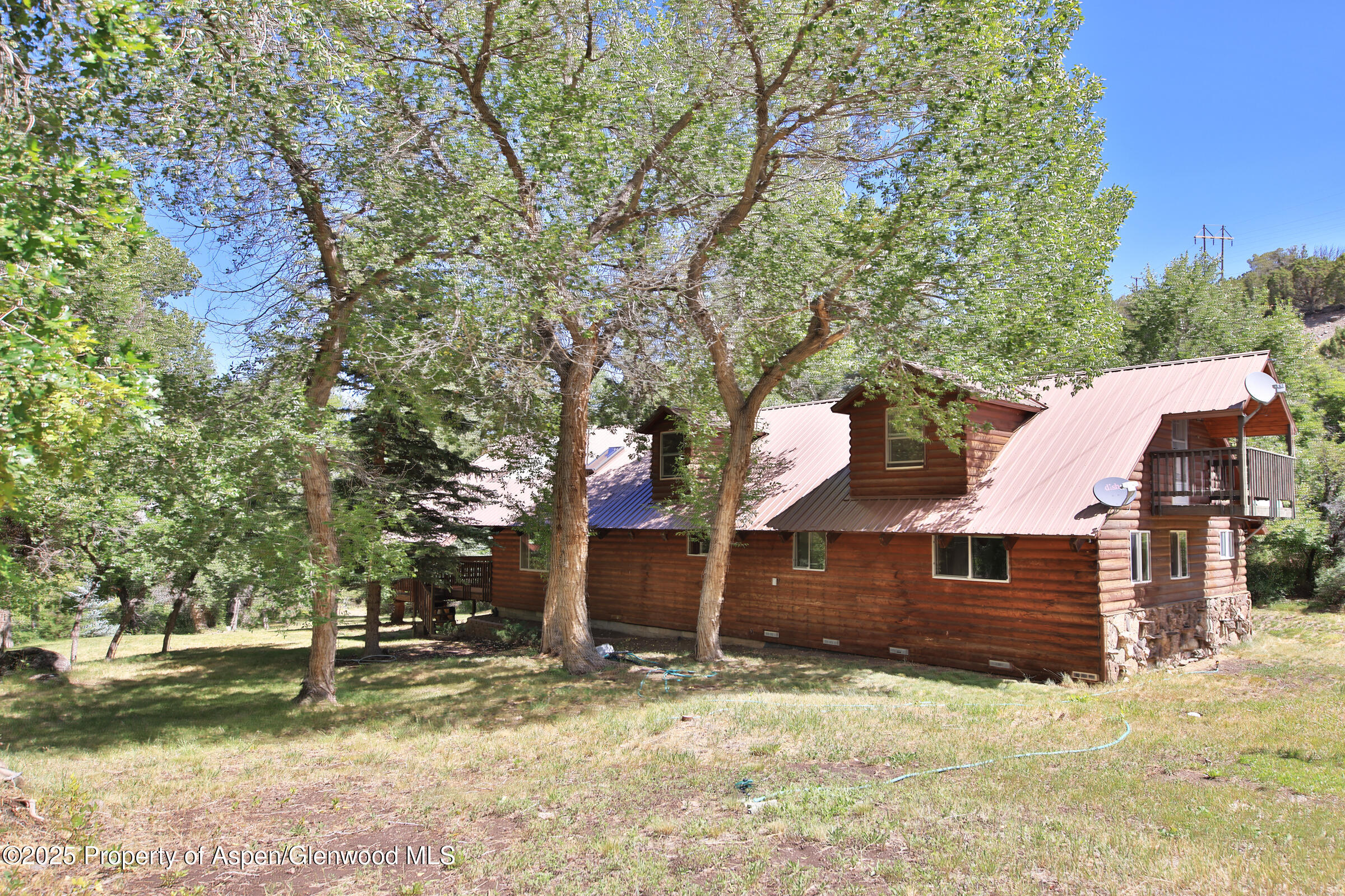 9681 54 7/10 Road Molina, CO 81646 - Photo 3 of 39 a front view of a house with a yard