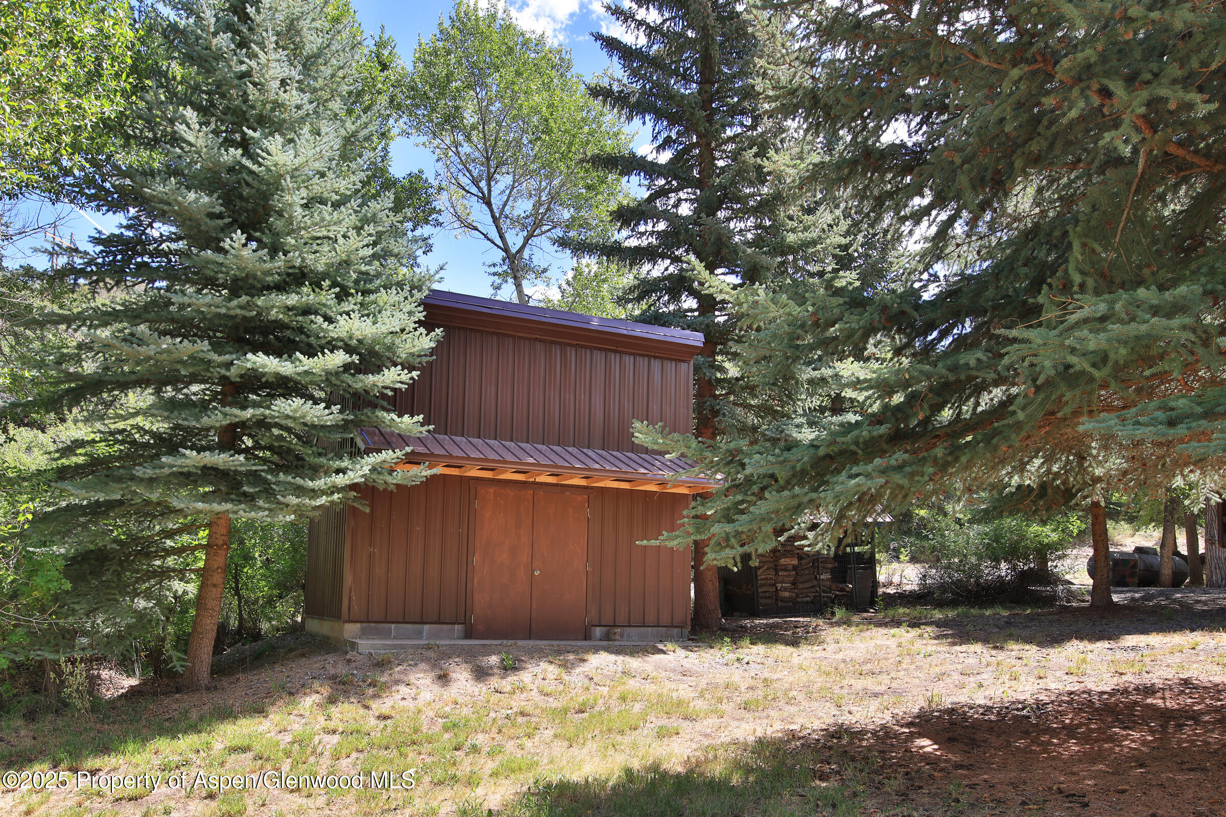 9681 54 7/10 Road Molina, CO 81646 - Photo 34 of 39 a view of a house with a yard covered in snow