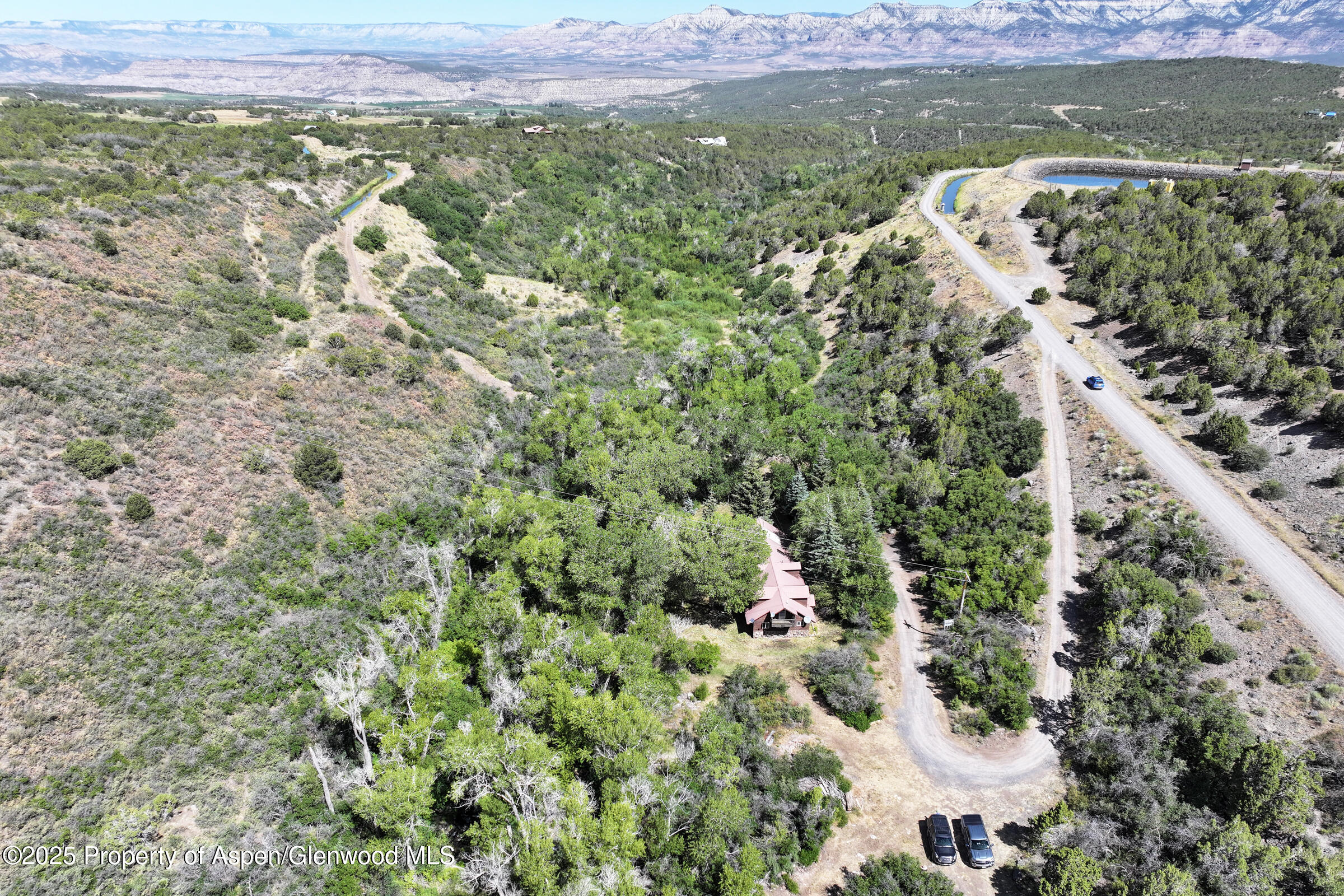 9681 54 7/10 Road Molina, CO 81646 - Photo 36 of 39 a view of a city with lush green forest