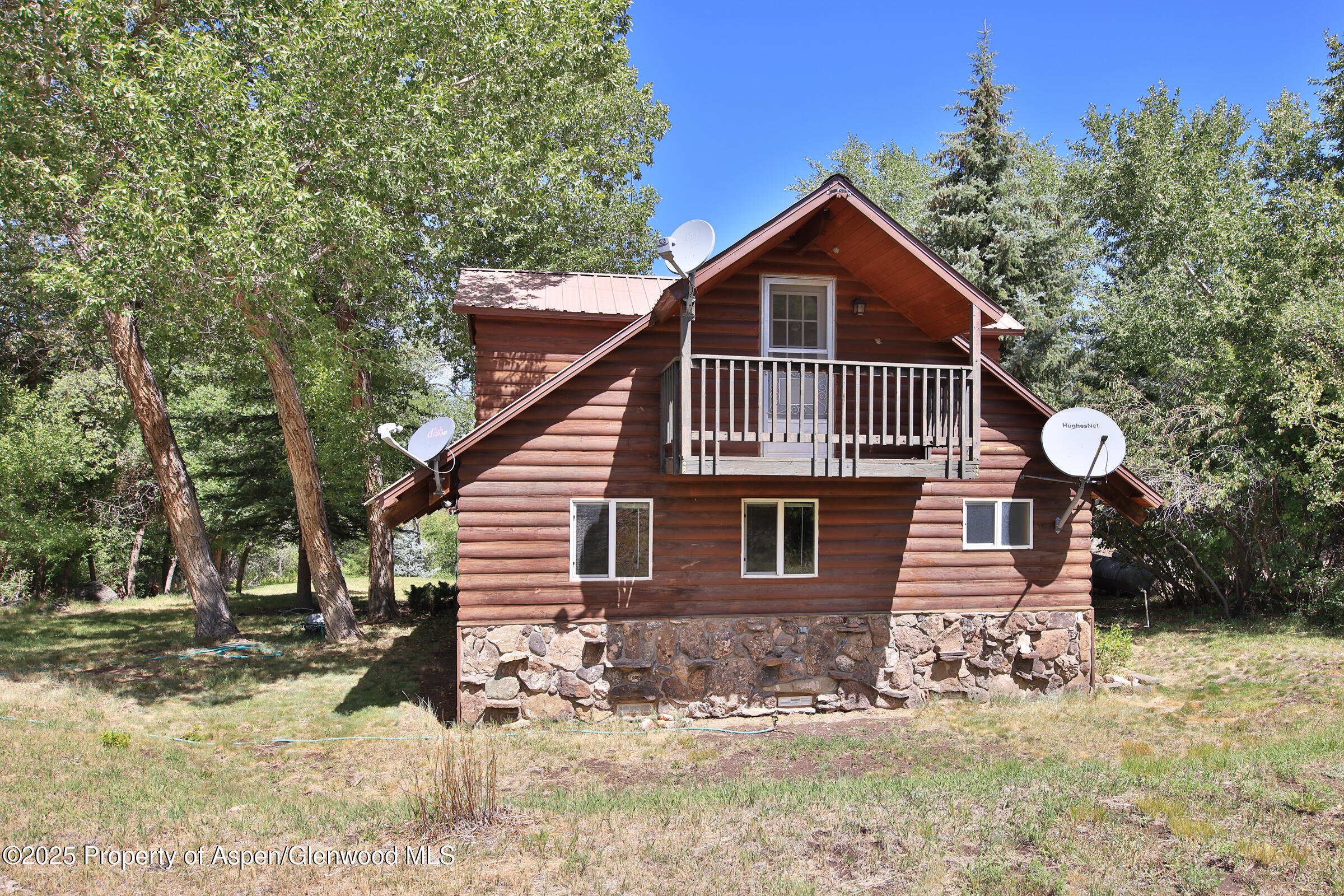 9681 54 7/10 Road Molina, CO 81646 - Photo 4 of 39 a view of a house with a yard