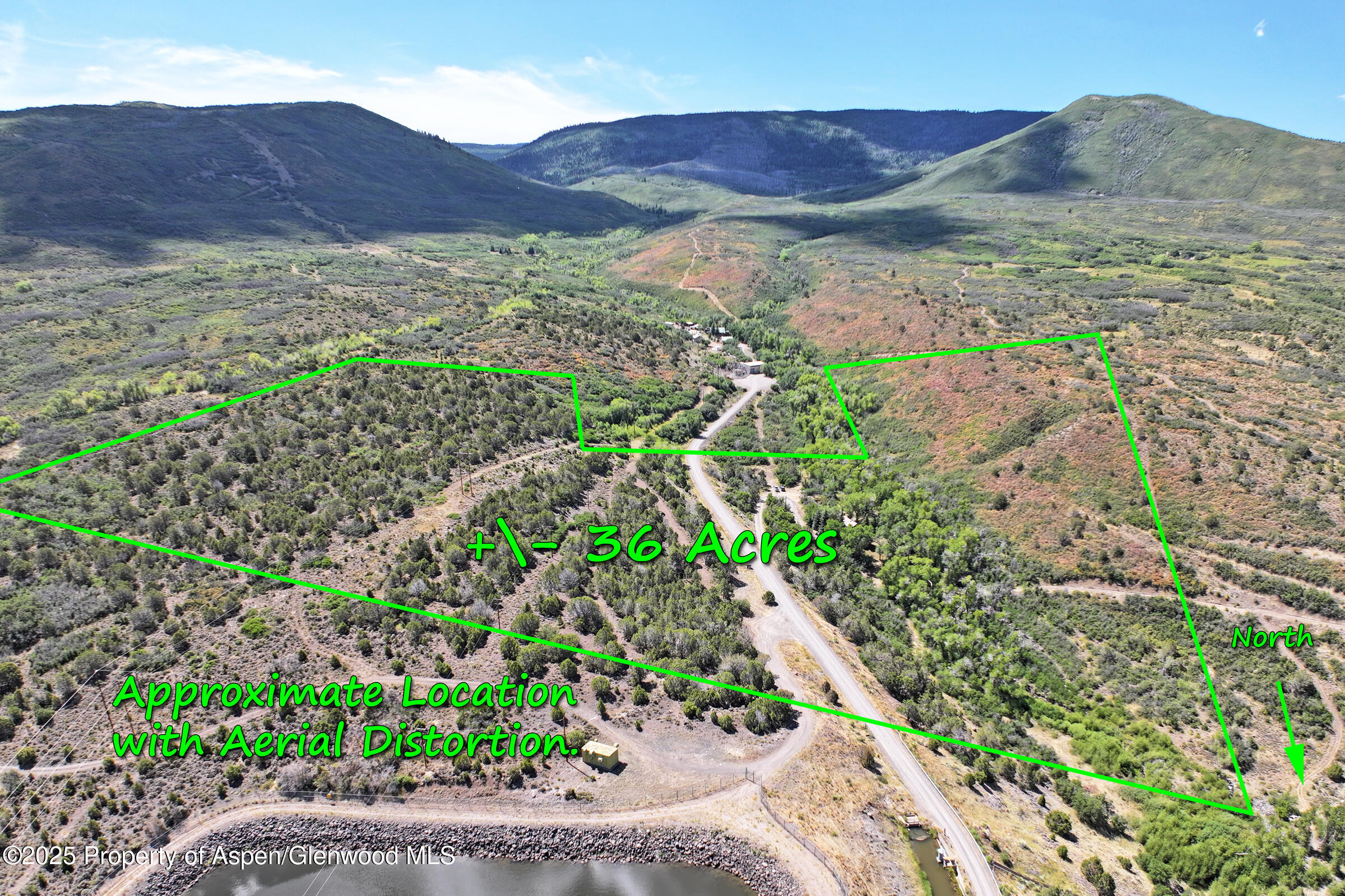 9681 54 7/10 Road Molina, CO 81646 - Photo 5 of 39 a view of a lush green hillside and a houses