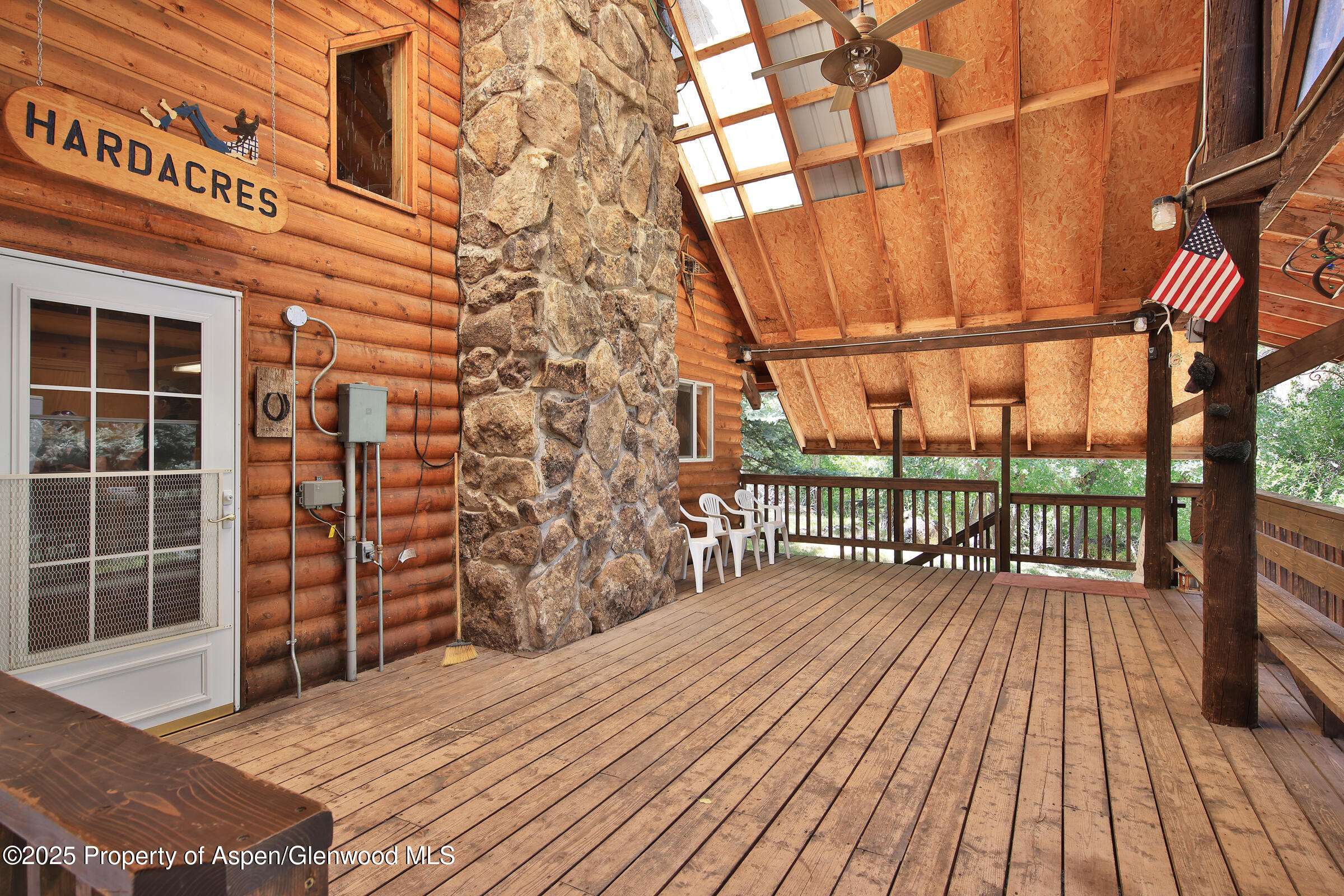 9681 54 7/10 Road Molina, CO 81646 - Photo 8 of 39 a view of a balcony with wooden floor and iron stairs