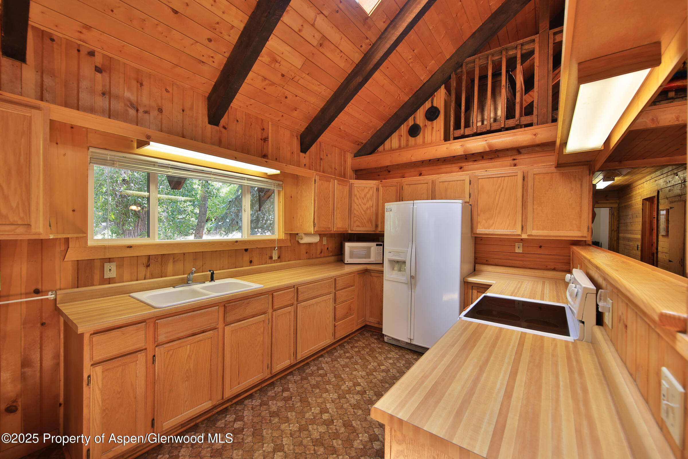 9681 54 7/10 Road Molina, CO 81646 - Photo 9 of 39 a kitchen with sink cabinets and window