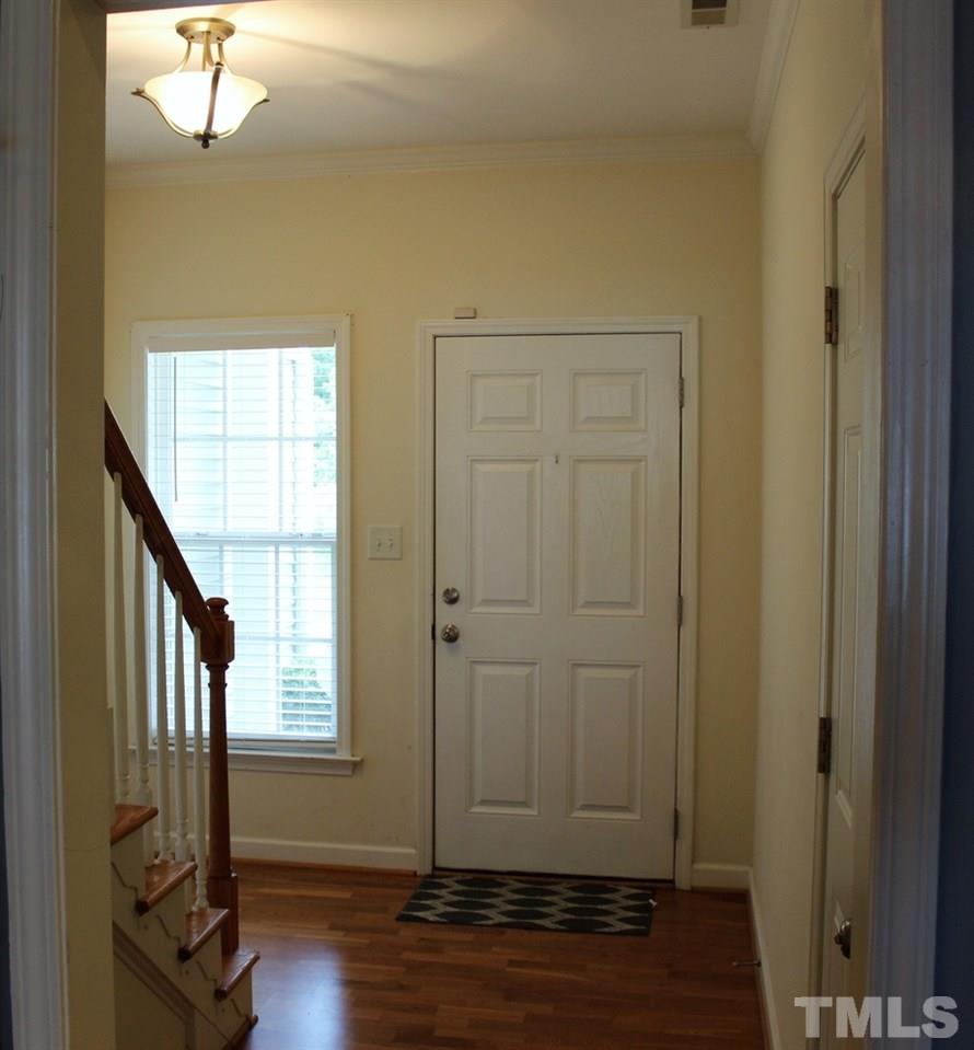 7304 Caversham Way Raleigh, NC 27617 - Photo 2 of 22 a view of empty room with wooden floor