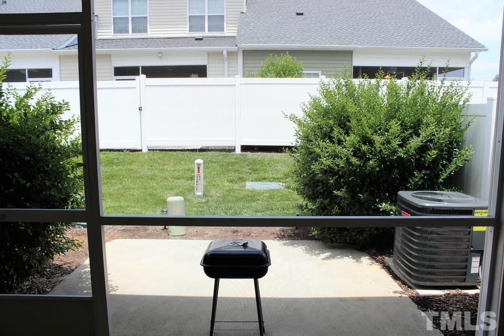 7304 Caversham Way Raleigh, NC 27617 - Photo 15 of 22 a couple of table and chairs in the patio