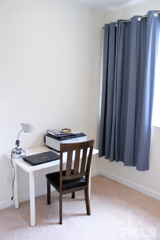 7304 Caversham Way Raleigh, NC 27617 - Photo 18 of 22 a view of a room with a table and chairs