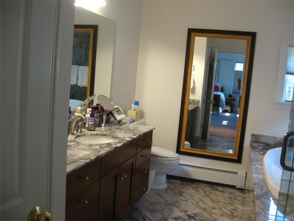 11 Princeton Road Wellesley, MA 02482 - Photo 13 of 22 a bathroom with a granite countertop sink a mirror and a bathtub