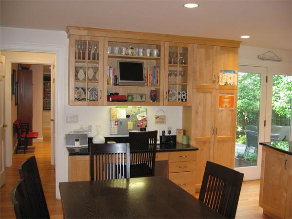 11 Princeton Road Wellesley, MA 02482 - Photo 5 of 22 a kitchen with stainless steel appliances granite countertop a stove top oven a sink a dining table and chairs