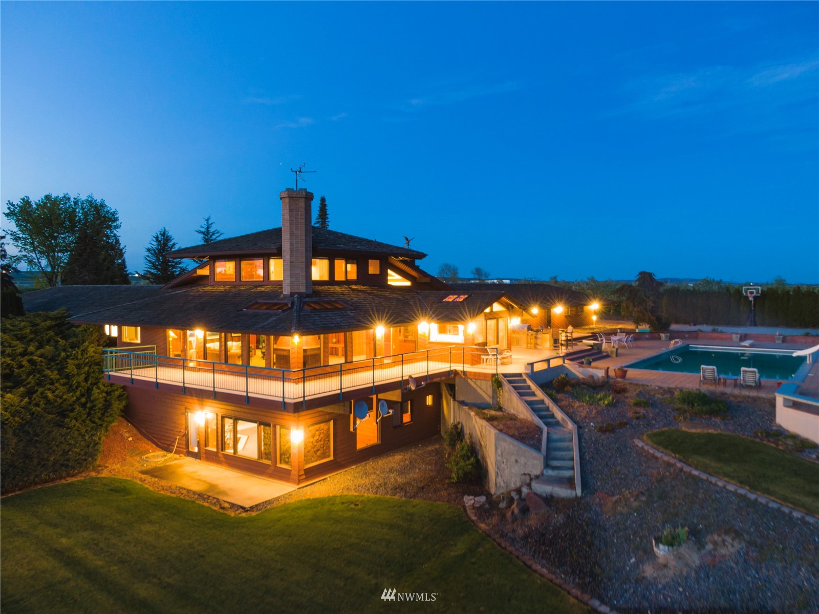 a view of a swimming pool with an outdoor seating