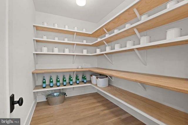 a spacious bedroom with a large bed and a couch