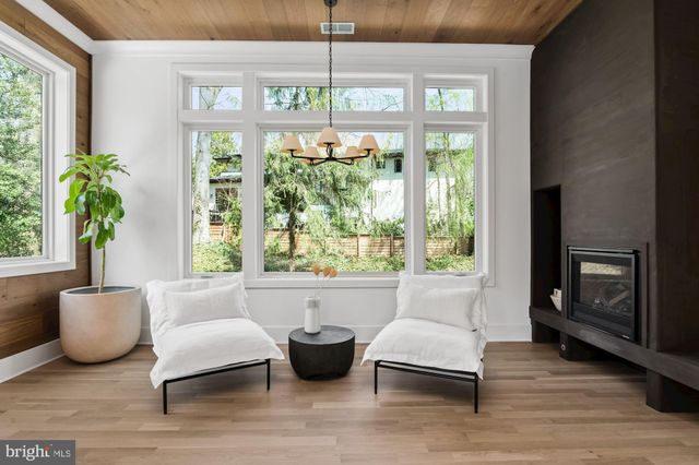 a view of kitchen with furniture and wooden floor