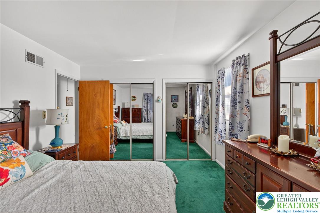 5424 Clauser Road Orefield, PA 18069 - Photo 18 of 31 a bedroom with a bed and a large mirror on the dresser