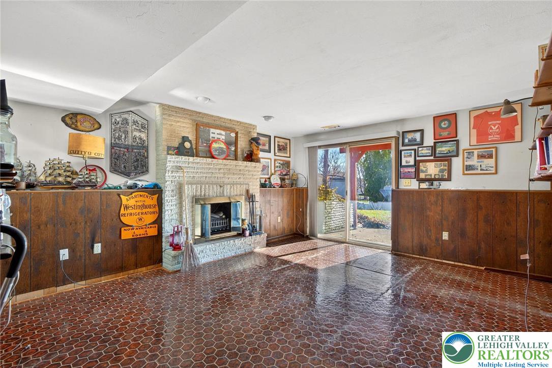 5424 Clauser Road Orefield, PA 18069 - Photo 21 of 31 a living room with furniture and a fireplace