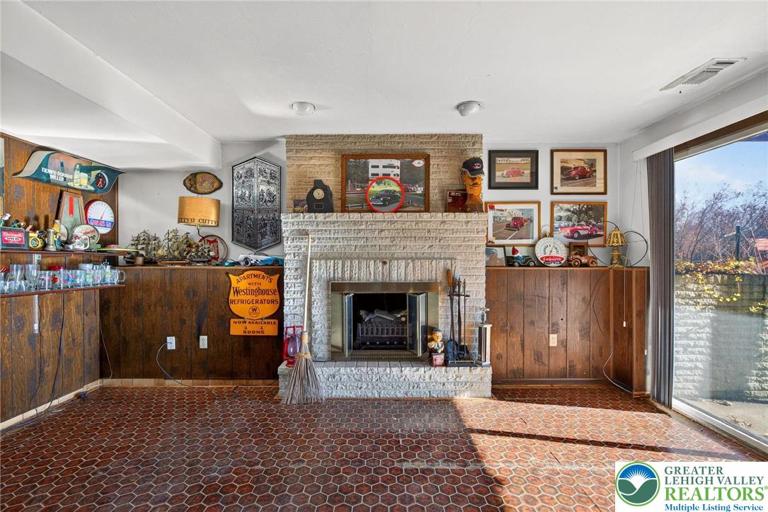 5424 Clauser Road Orefield, PA 18069 - Photo 23 of 31 a living room with furniture and a fireplace